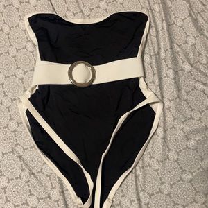 Black and white one piece bathing suit with belt